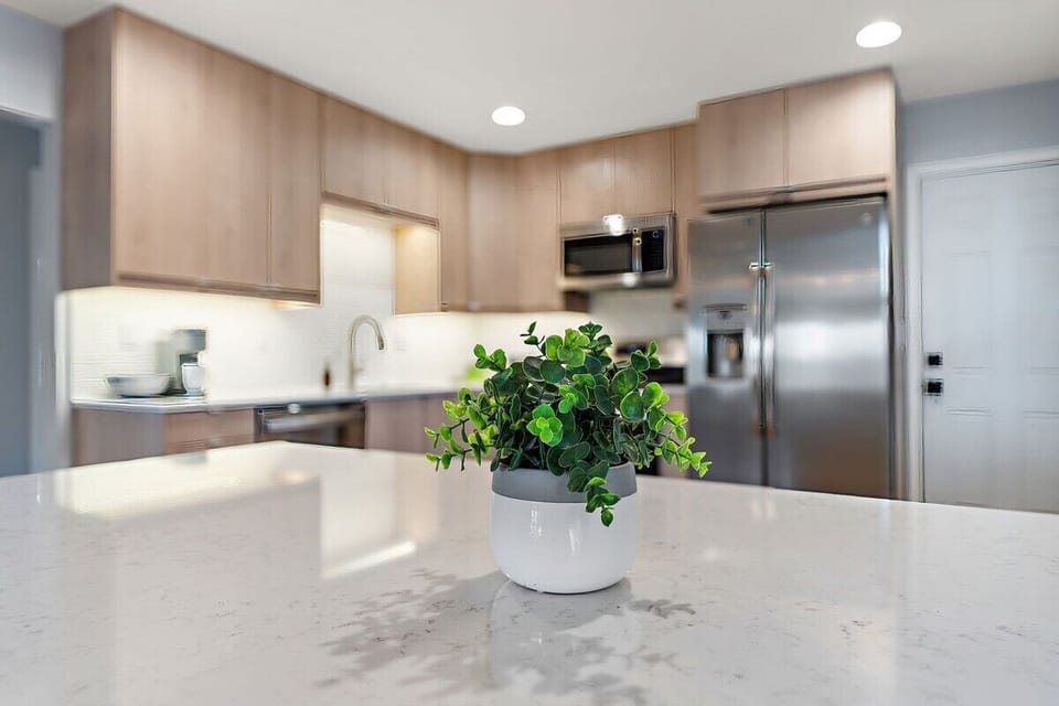 Kitchen with quartz countertops and stainless steel appliances