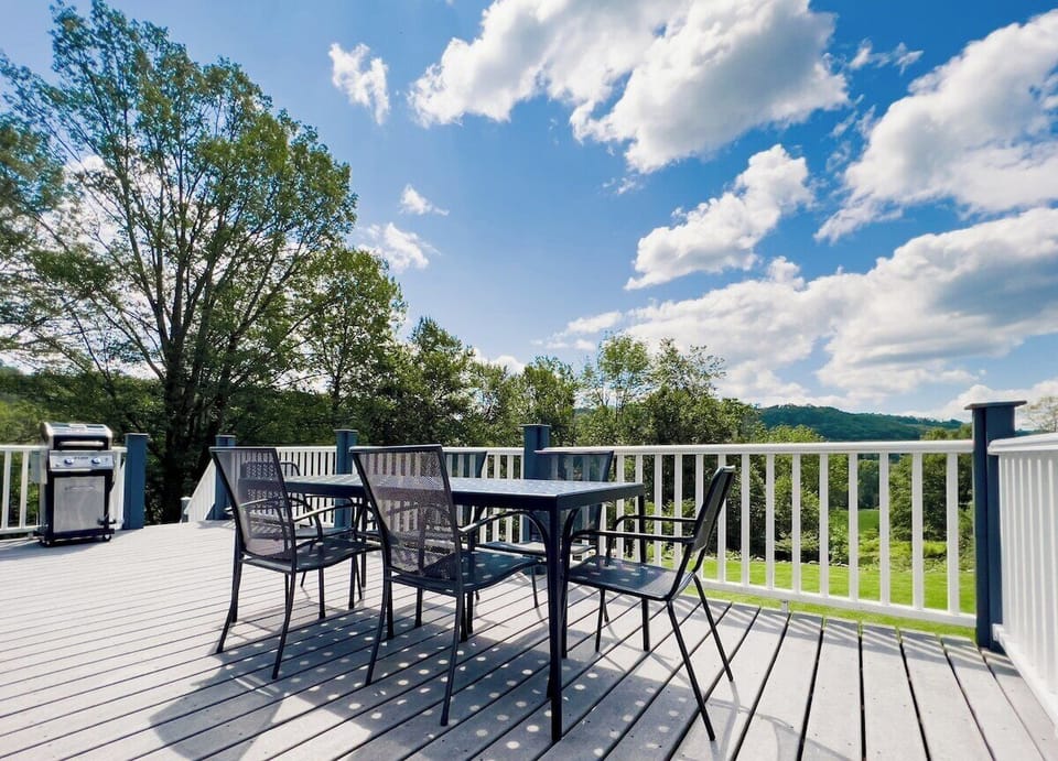 Deck with outdoor sitting area and 180 view of the mountains