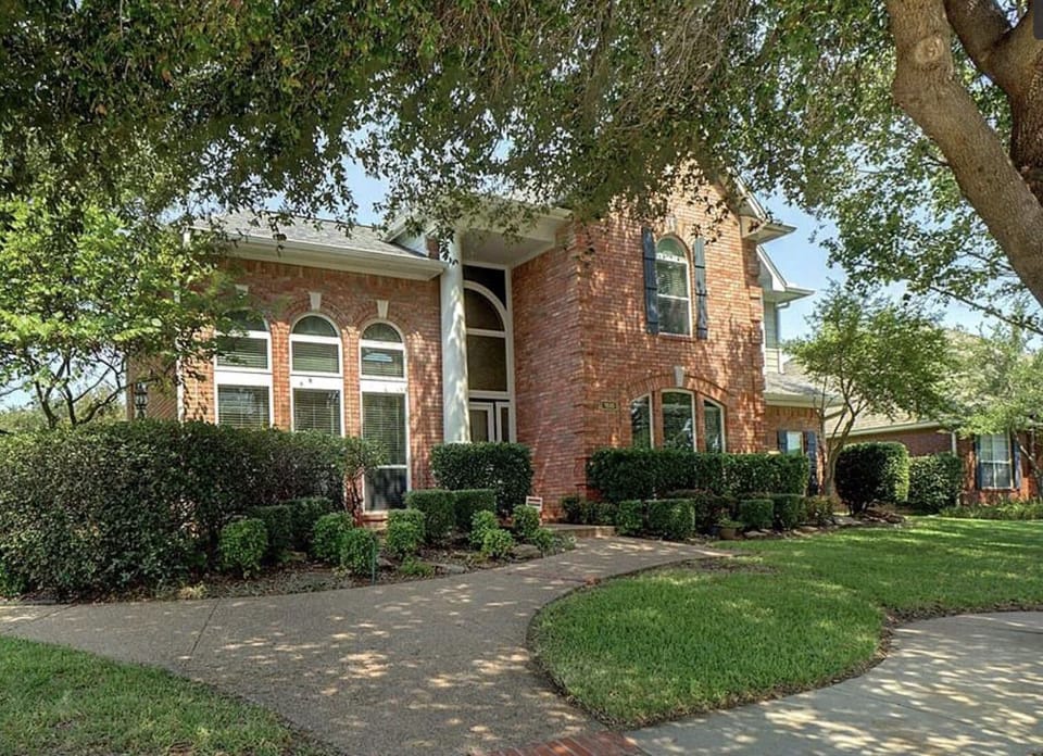 Front of our home! Large trees, beautiful sidewalks throughout the neighborhood.