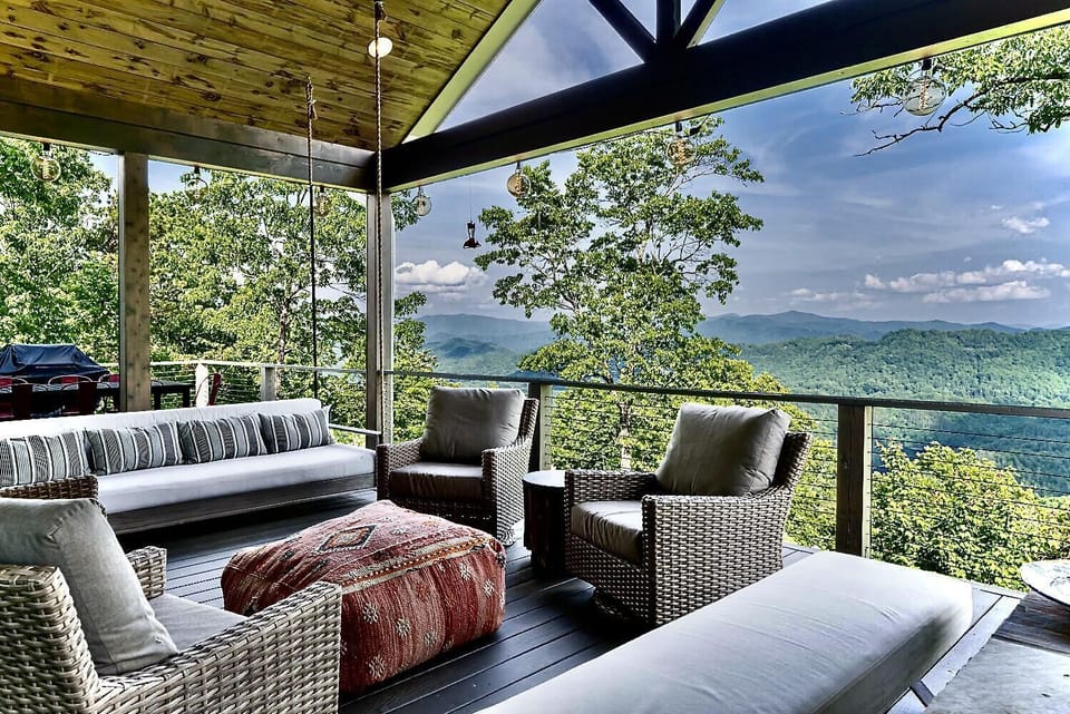 Covered Deck Overlooks Gorgeous Lake and Mountain Views