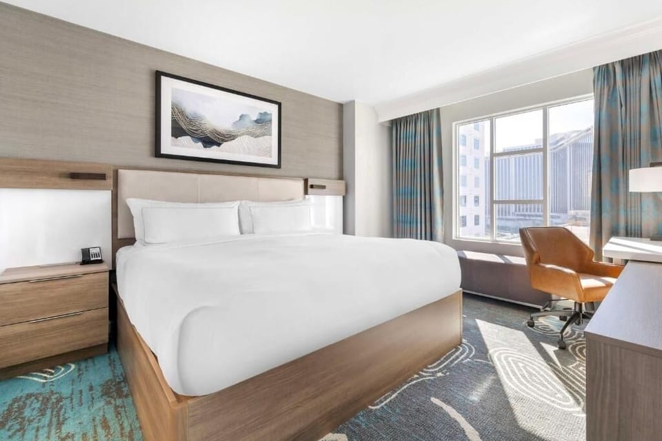 Bedroom. Exact unit will be assigned upon arrival. Views, colors, and decor may vary.