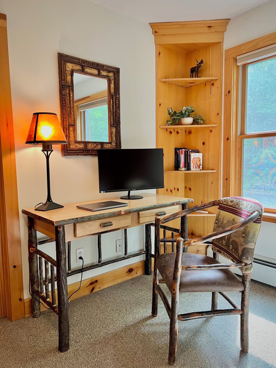 The master bedroom also has a dedicated workspace with 27-inch monitor