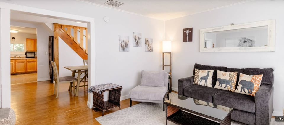 This gray chair converts to a bed for one. It opens flat. 