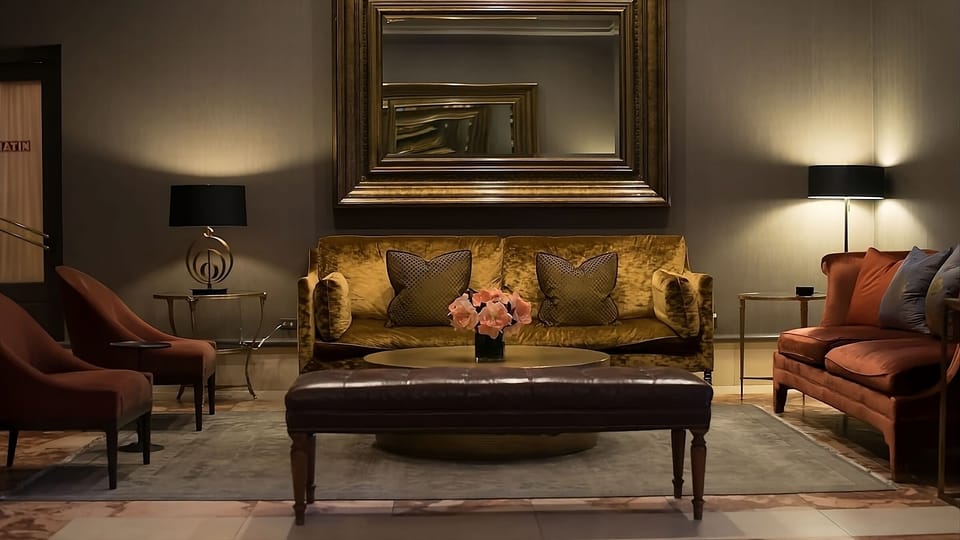 Unwind on plush seating under warm, ambient lighting.