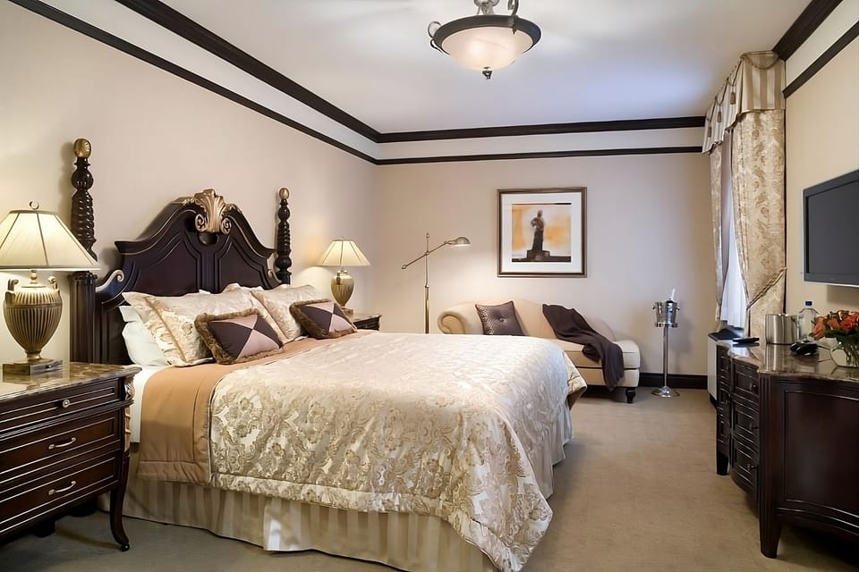 Unwind in a spacious king room with cozy lounge seating.