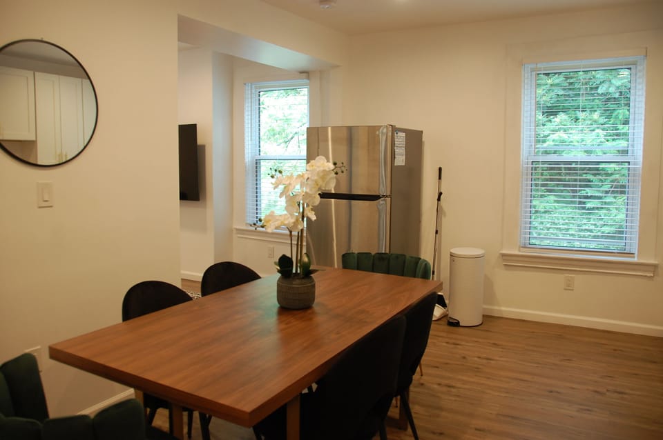 Kitchen and dining area with granite countertop and stainless appliances