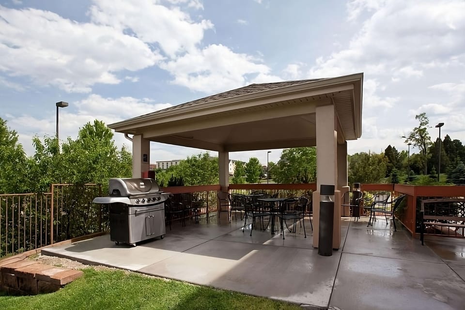 Unwind outdoors under the pavilion with grill-ready seating.