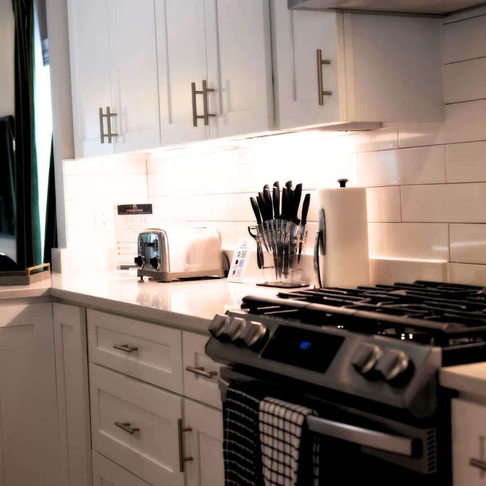 A fully functional kitchen—equipped with top-tier appliances, ample counter space, and everything you need for a seamless cooking experience. It’s where style meets efficiency, making your Cleveland stay feel like home.