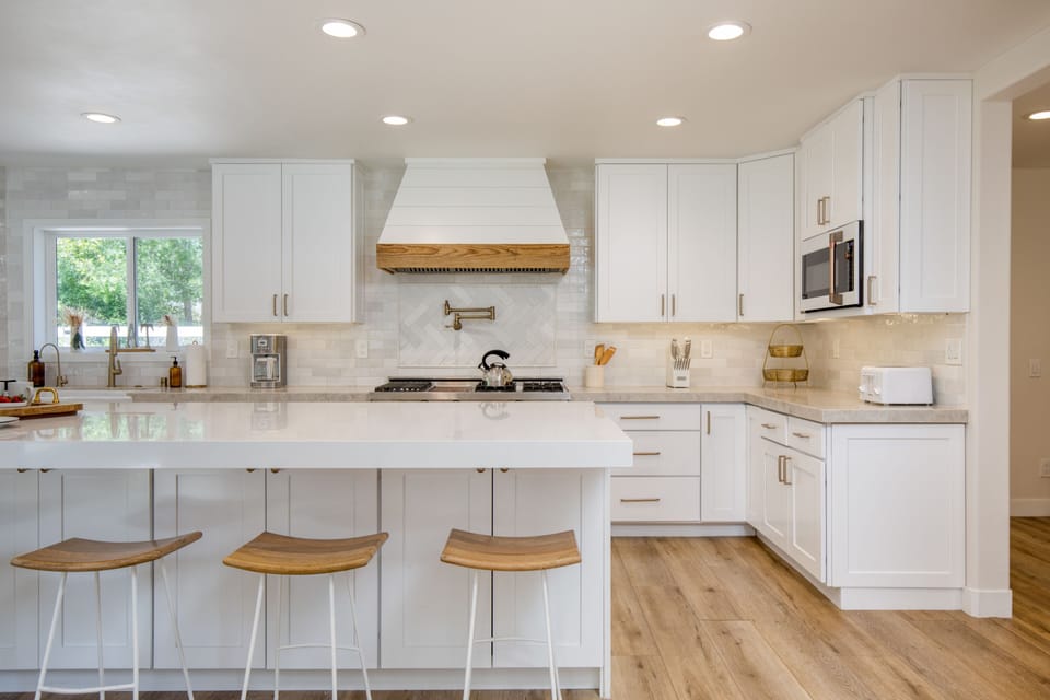 Additional barstool seating at the kitchen counter.