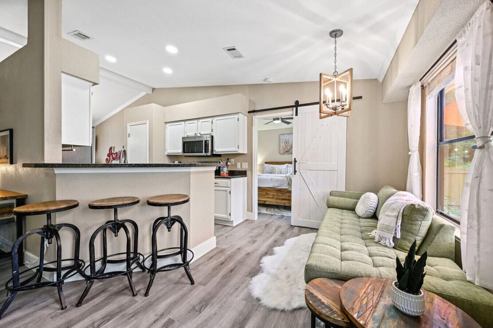 Cozy sitting nook off the kitchen with bar seating and chaise lounge—perfect for morning coffee or evening wine.