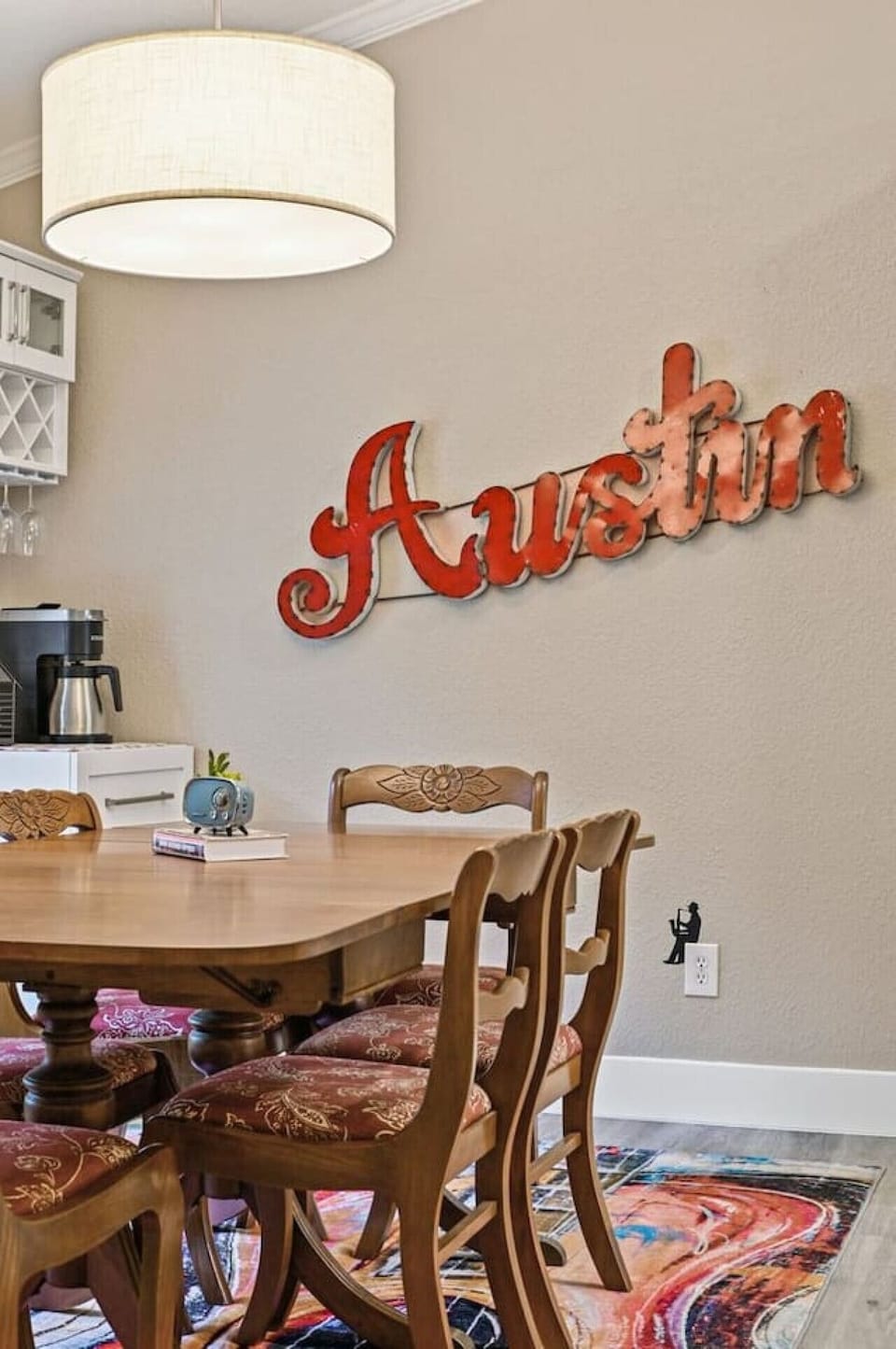 Dining area with Austin‑themed decor and coffee station, ready for work sessions, board games, or shared meals.