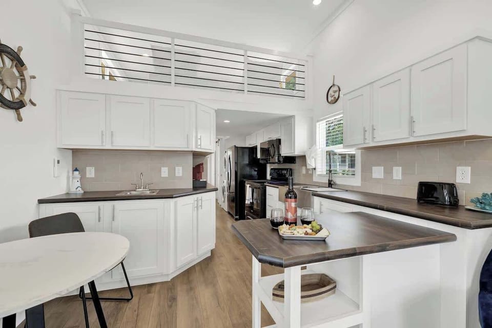 Kitchen opens to living room.