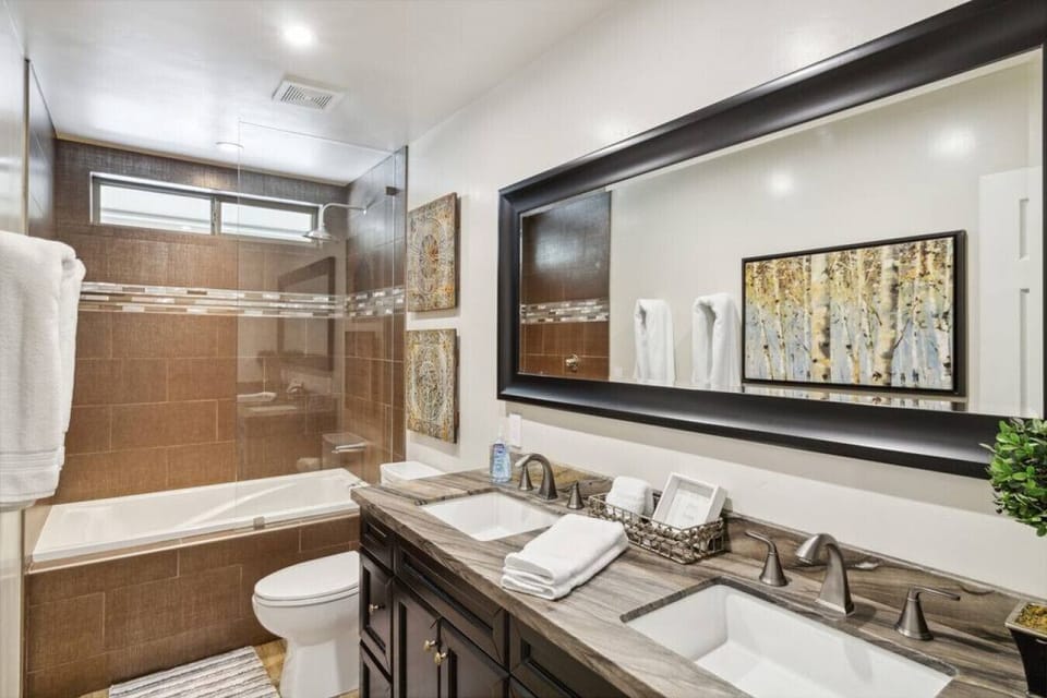 Modern bathroom with double vanity and walk-in shower