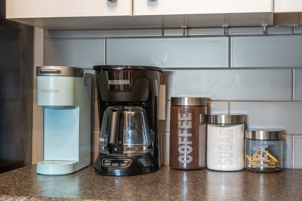 Full kitchen with a drip coffee machine, ground coffee, tea, sugar and basic condiments (ketchup, mustard and relish.)