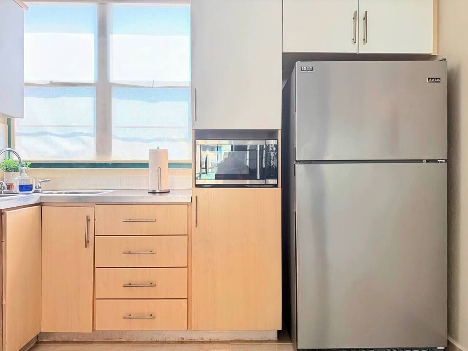 Bright kitchen with stainless appliances and great natural light