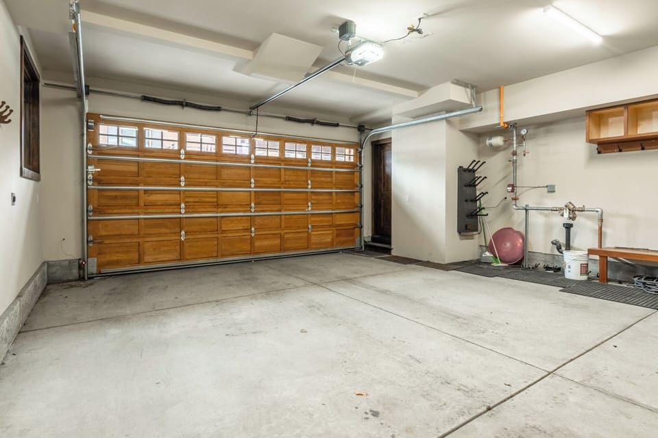 The oversized private garage offers ample space for vehicles and gear — a rare convenience in Mammoth.