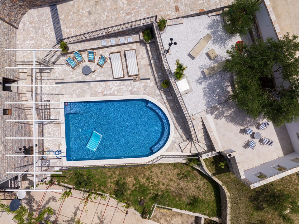 Private pool with large stone patio