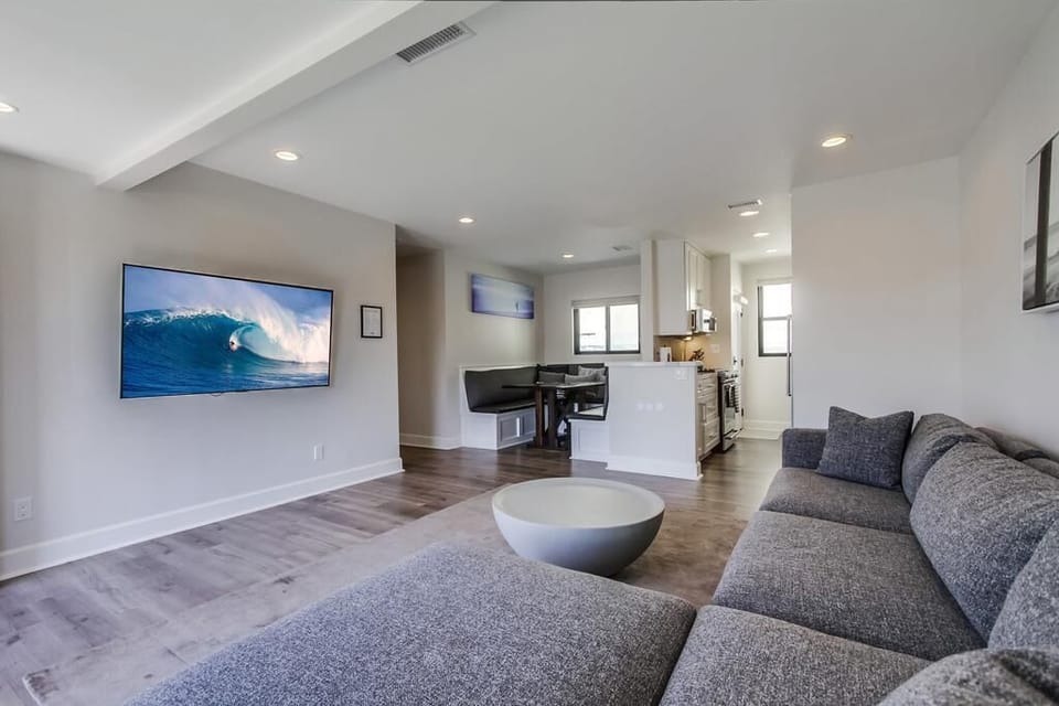 Bright & Sunny open floorplan main living area with 65" LG OLED TV!