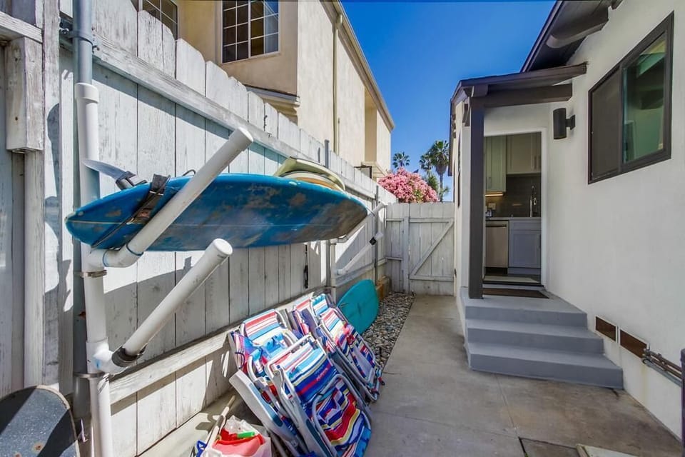 Rear yard located off kitchen with beach gear & bbq