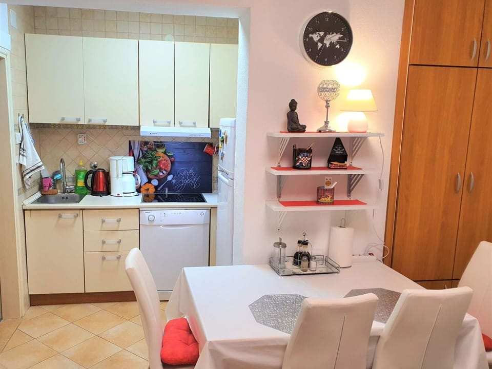 Property, Furniture, Cabinetry, Shelving, Orange, Interior Design, Chair, Shelf, Wood, Picture Frame