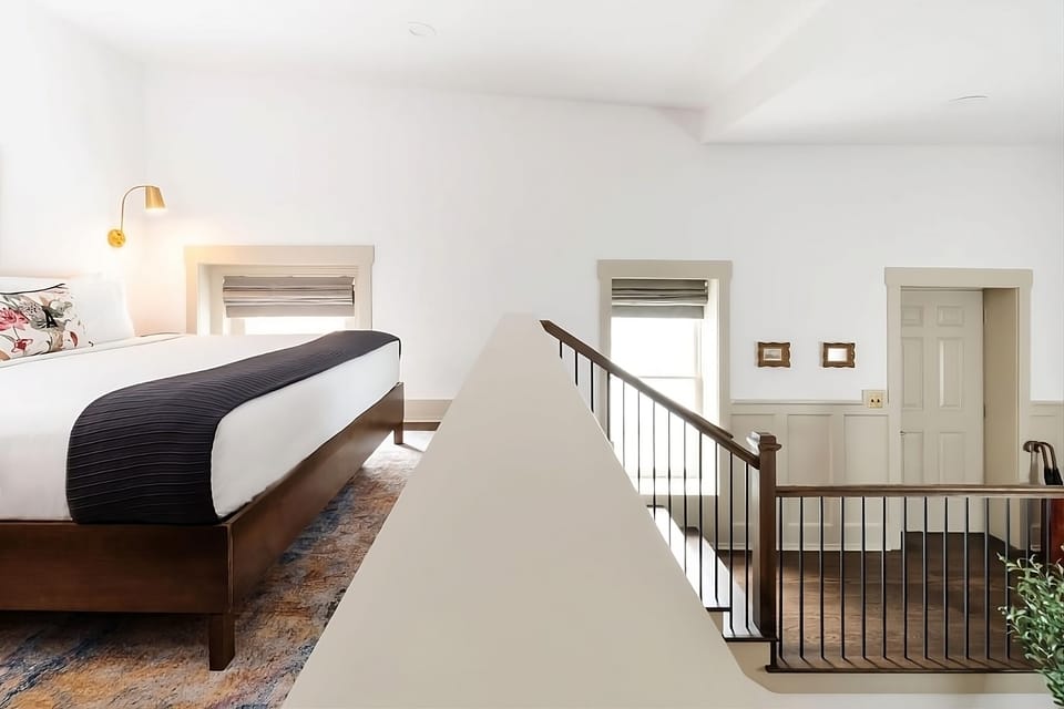Unwind in an airy loft bedroom with bright natural light.