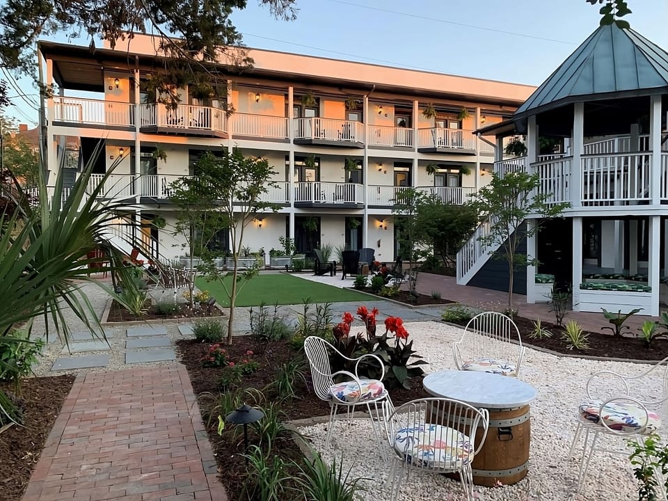 Unwind in the sunny courtyard with garden paths and seating.