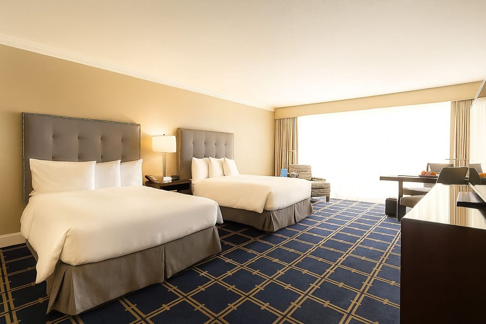 Settle into a sunlit room with two plush beds.