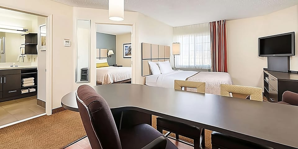 Gather and plan your day with a roomy table and suite layout.