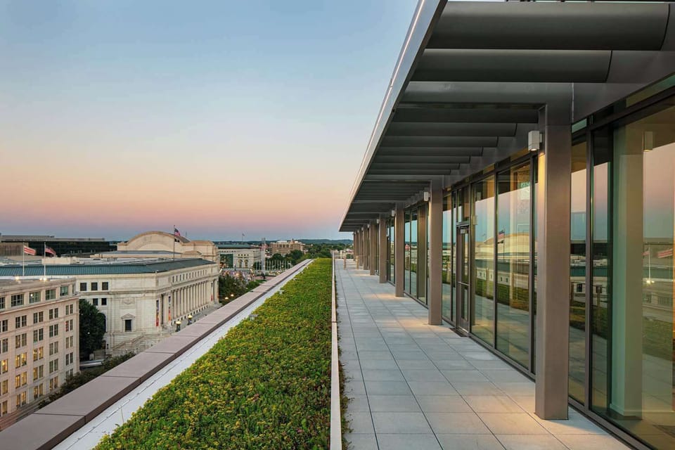 Unwind at sunset on the rooftop terrace above the city.