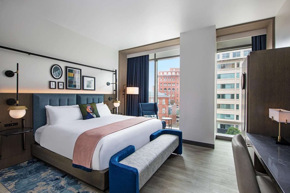 Unwind in a spacious room with floor-to-ceiling city views.