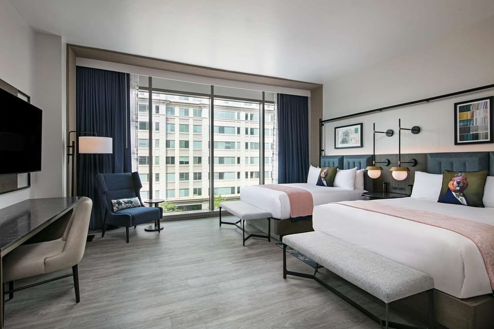 Stretch out in a spacious room with panoramic city windows.