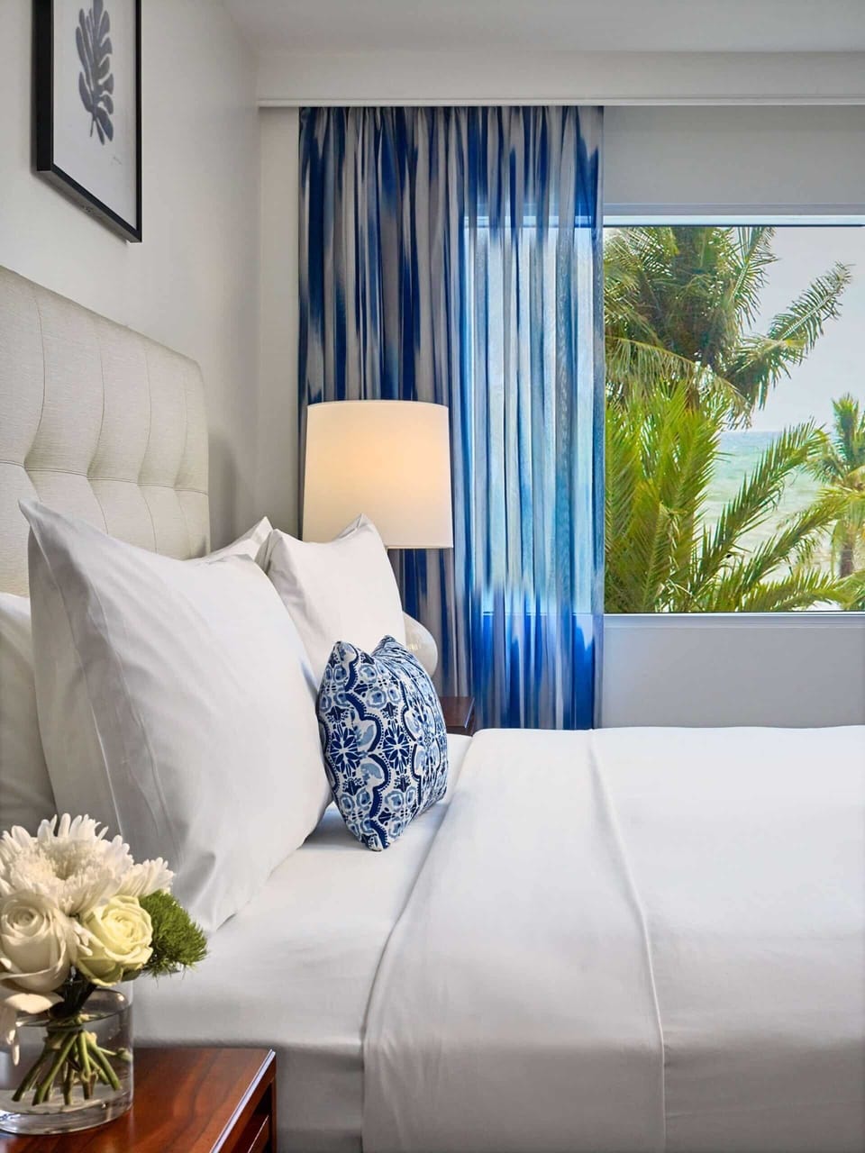 Savor morning calm as palm-framed views brighten the bed.