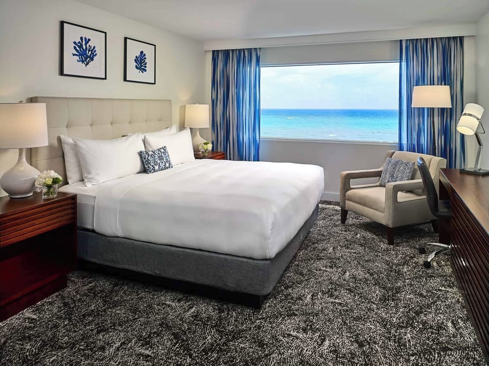 Wake up to ocean vistas from crisp, cloud-soft bedding.
