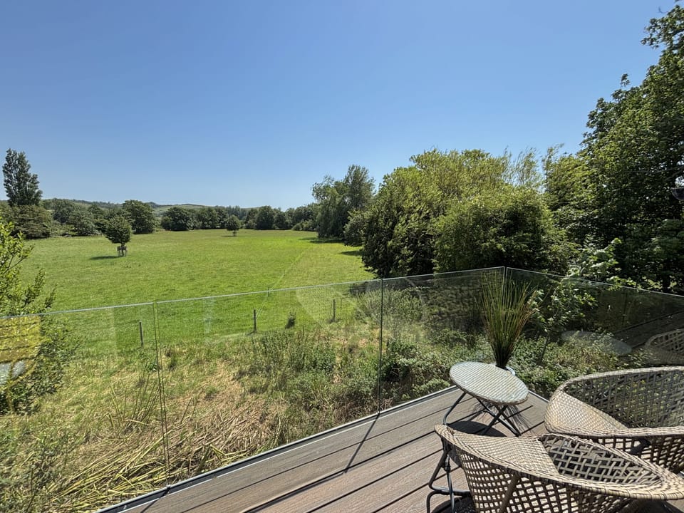 The Old Piggeries, Burton Bradstock: Soak up the sunshine and stunning views from the first floor glass balcony