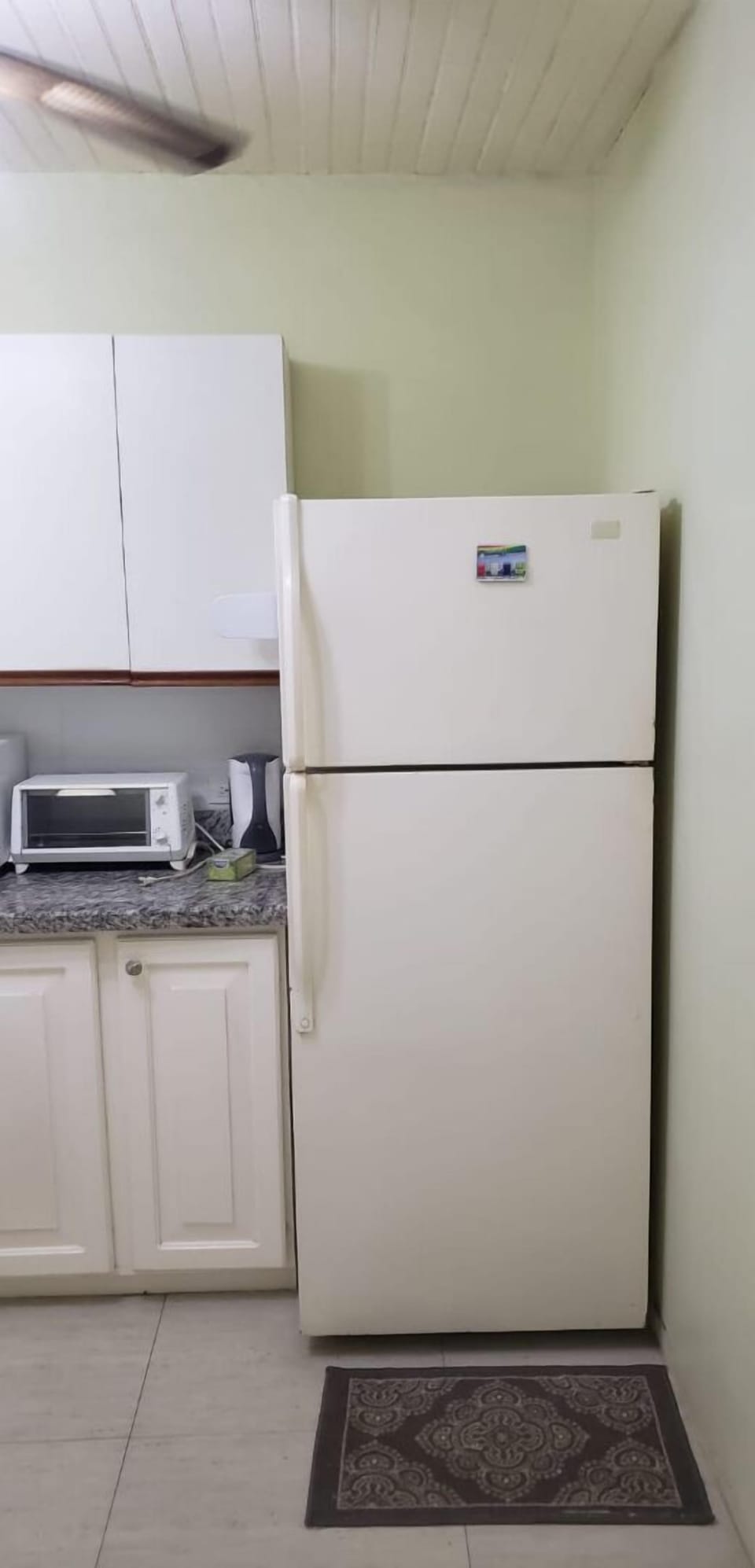 Fridge,toaster oven and kettle. 