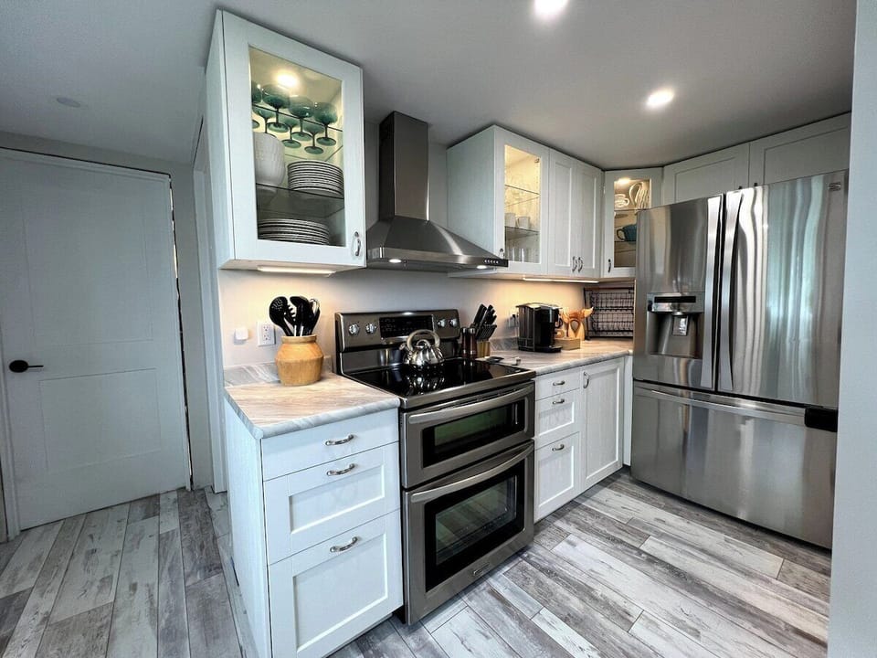 We have a fully equipped kitchen featuring: an electric stove with double oven, french door refrigerator with ice and water in the door, dishwasher, all of the utensils, cooking utensils etc... you would need to prepare the most delicious of meals. 