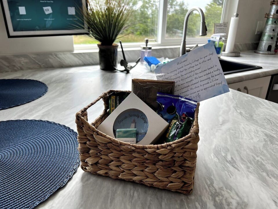 A welcome basket will greet you with a few snacks, a locally made gift and a custom holiday ornament as a special gift from us to you for you to commemorate your stay here at Seaside Serenity Cottage. 