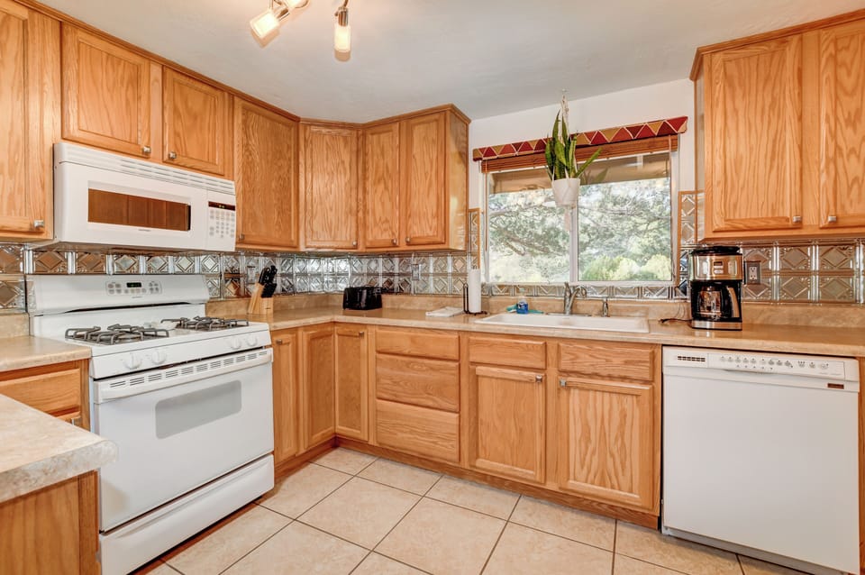 Gas Stove/Oven.  Full-size microwave, toaster, drip coffeemaker, and dishwasher