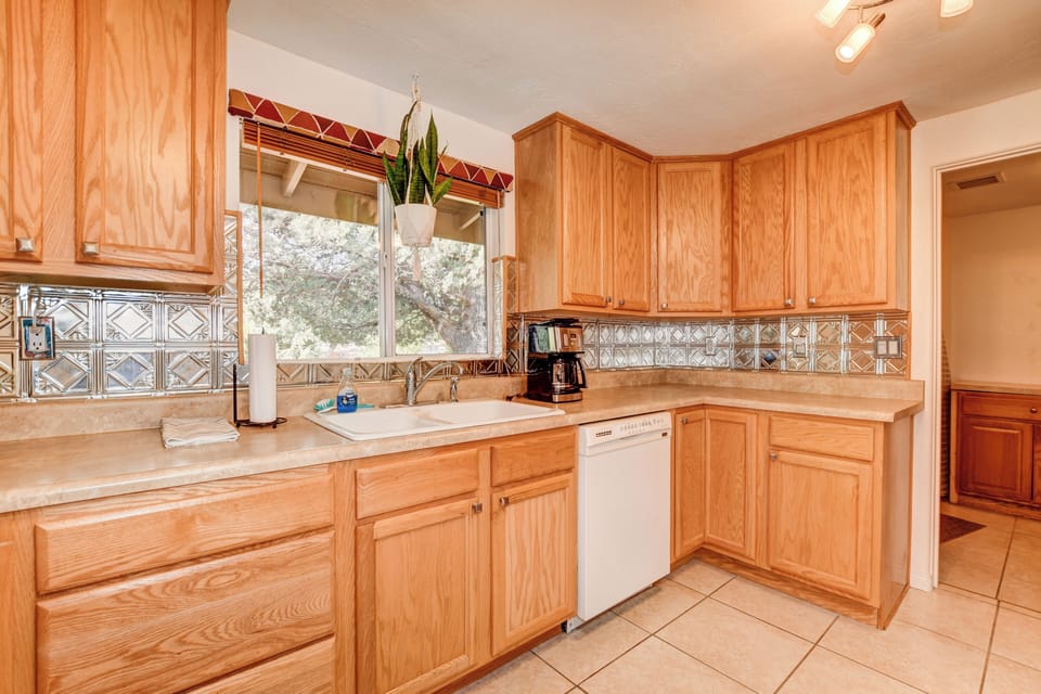 Kitchen with view from front of house.  Full-size drip coffeemaker & dishwasher