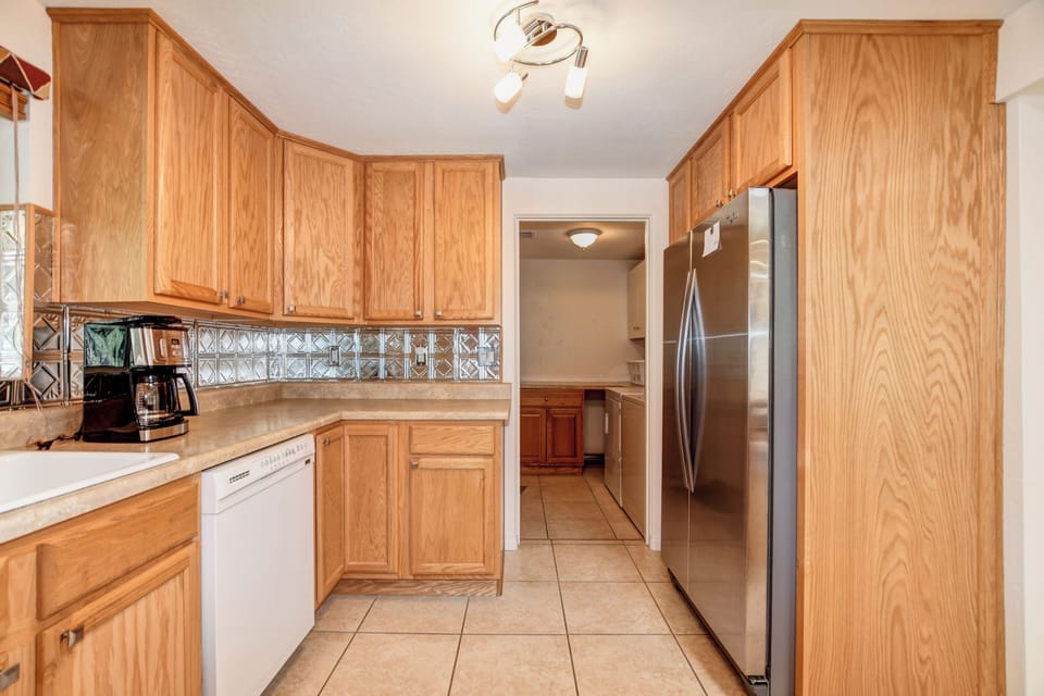 Side-by-Side refrigerator, side door leading to utility/Laundry room