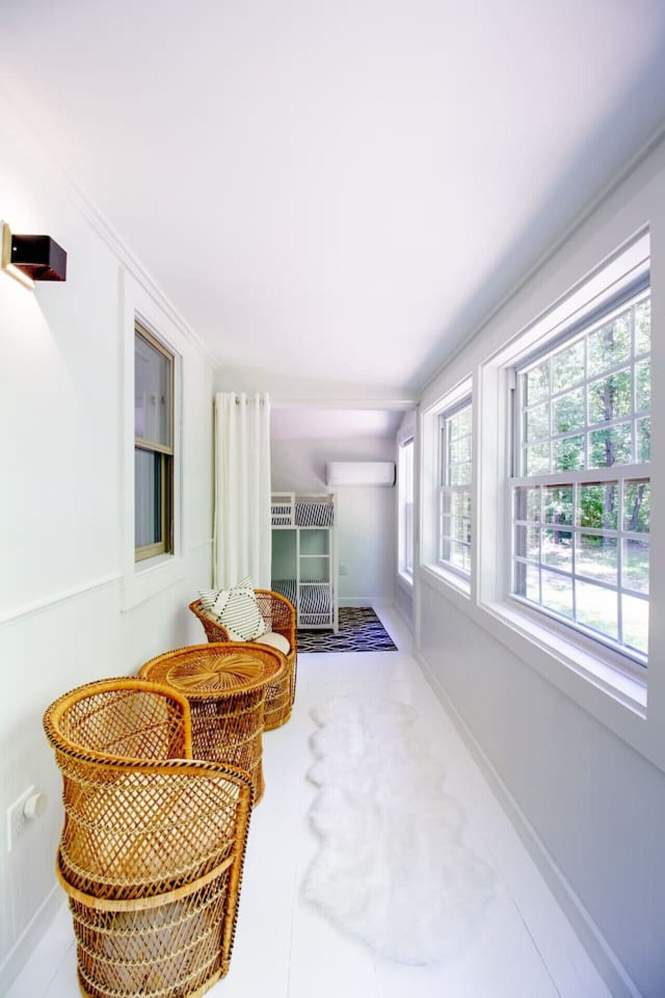 Bedroom 5 includes this cozy wicker seating with peaceful views making this the perfect morning coffee spot 🍵🌿 #VacationRentalVibes #RelaxAndUnwind