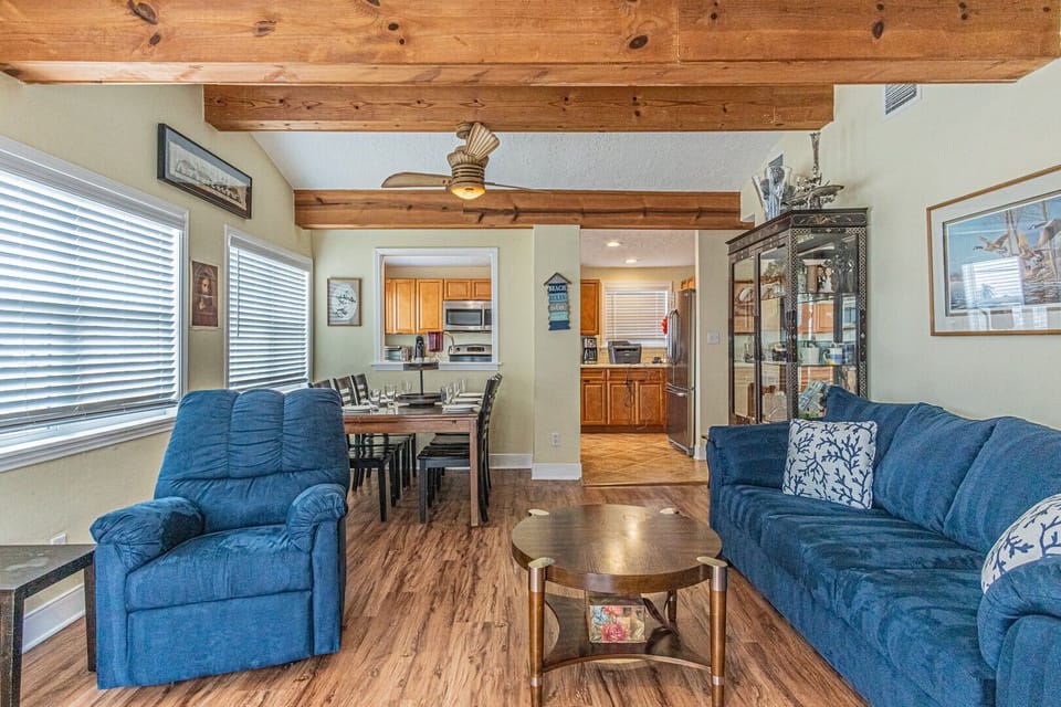 Open concept living with cozy furniture which includes a queen size pull out sofa. Flat screen TV with free cable and streaming abilities