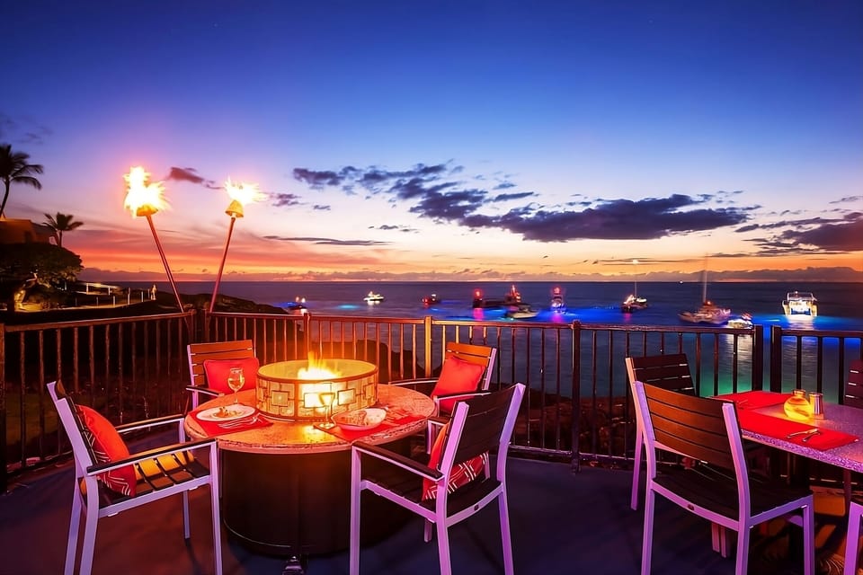 Sip cocktails by the fire as sunsets glow over the bay.