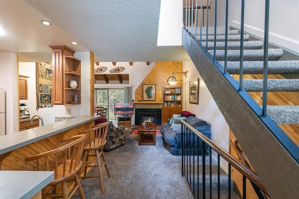The main level of this townhome is a warm and inviting space with an open and social floor plan featuring the kitchen/dining room/living room.