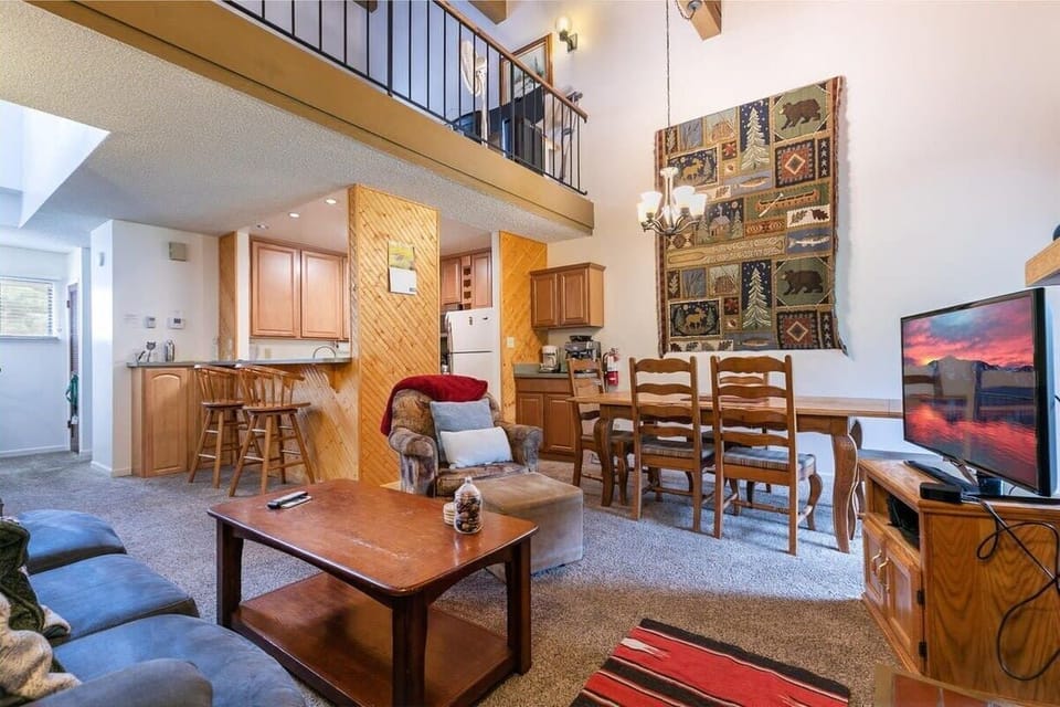 With high ceilings and sliding doors leading out to a small balcony, the main level is filled with natural light.