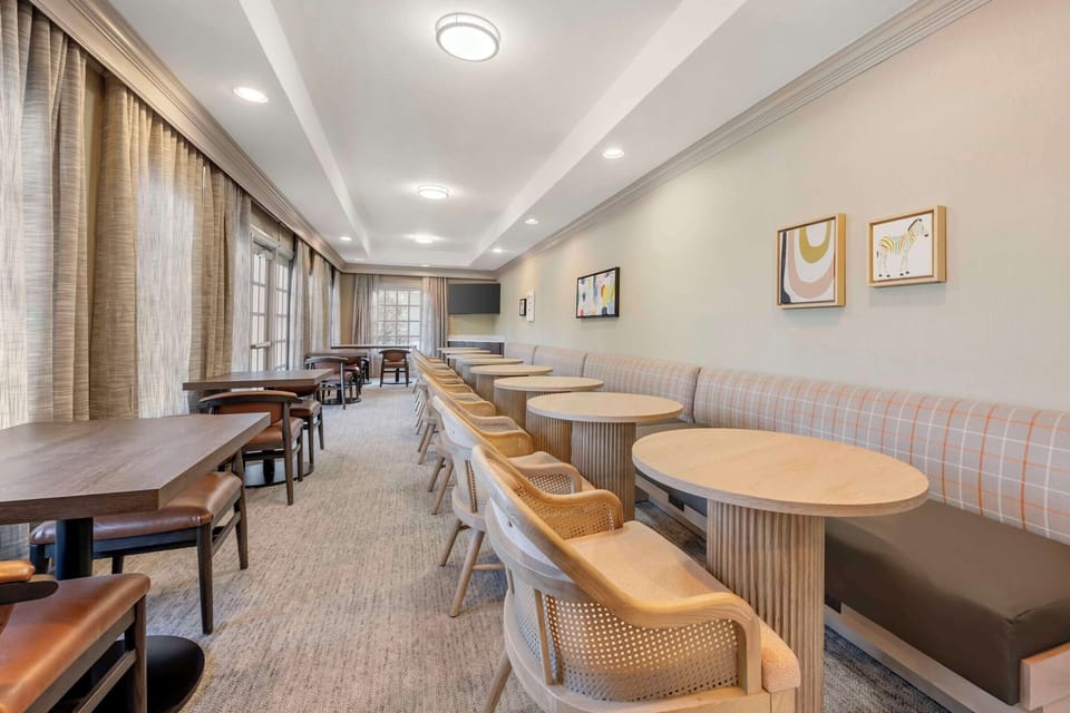 Start your morning slowly with bright, comfortable breakfast seating.