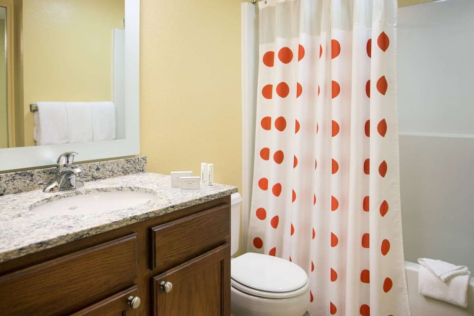 Refresh easily with a bright vanity and spotless bath setup.