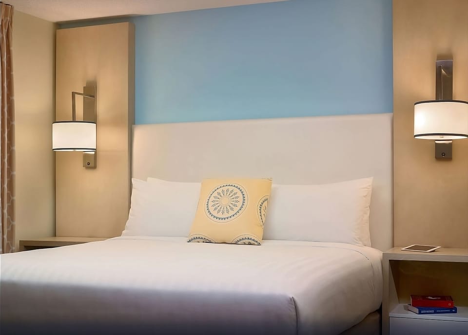 Unwind into crisp linens and soft lighting after adventures.