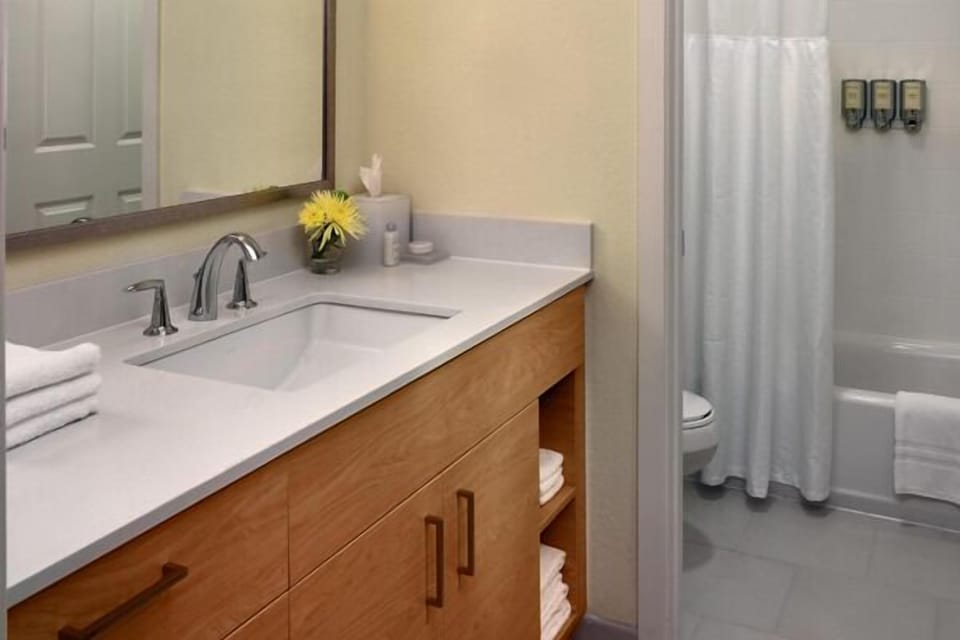 Step into a clean, bright bath with ample counter space.