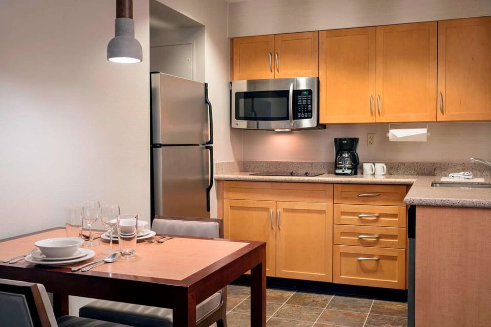 Cook easy meals in a sleek kitchenette with full-size fridge.